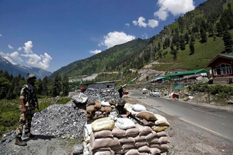 India's Border Security Force (BSF) soldiers stand guard at a checkpoint along a highway leading to Ladakh, at Gagangeer in Kashmir's Ganderbal district, June 17, 2020 — Reuters