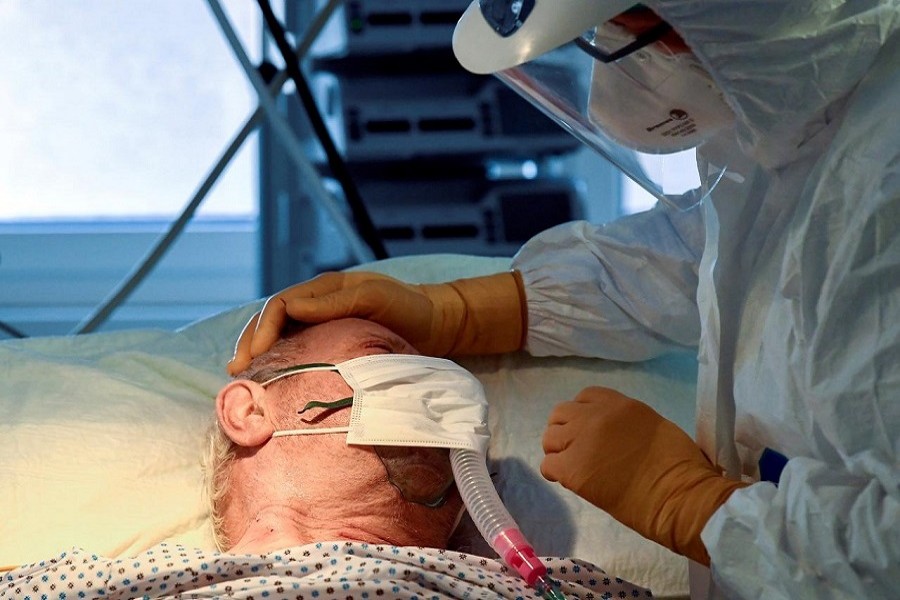 A medical staff member is seen next to a patient suffering from the coronavirus disease (Covid-19) in the intensive care unit at the Circolo hospital in Varese, Italy, April 09, 2020 — Reuters/Files