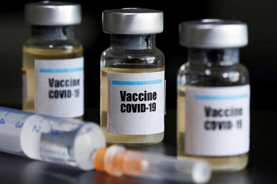 Small bottles labeled with a "Vaccine COVID-19" sticker and a medical syringe are seen in this illustration taken April 10, 2020 — Reuters/Illustration