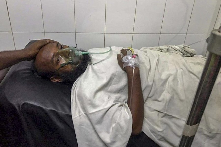 Sumon Bepari, 35, was admitted to Mitford Hospital in Dhaka when rescuers found him inside a launch 13 hours after it capsized on the Buriganga river in the capital - Collected/ bdnews24.com