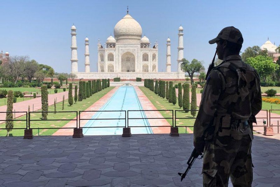 A member of Central Industrial Security Force (CISF) personnel stands guard inside the empty premises of the historic Taj Mahal during a 21-day nationwide lockdown to slow the spread of Covid-19, in Agra, India on April 2, 2020 — Reuters/Files