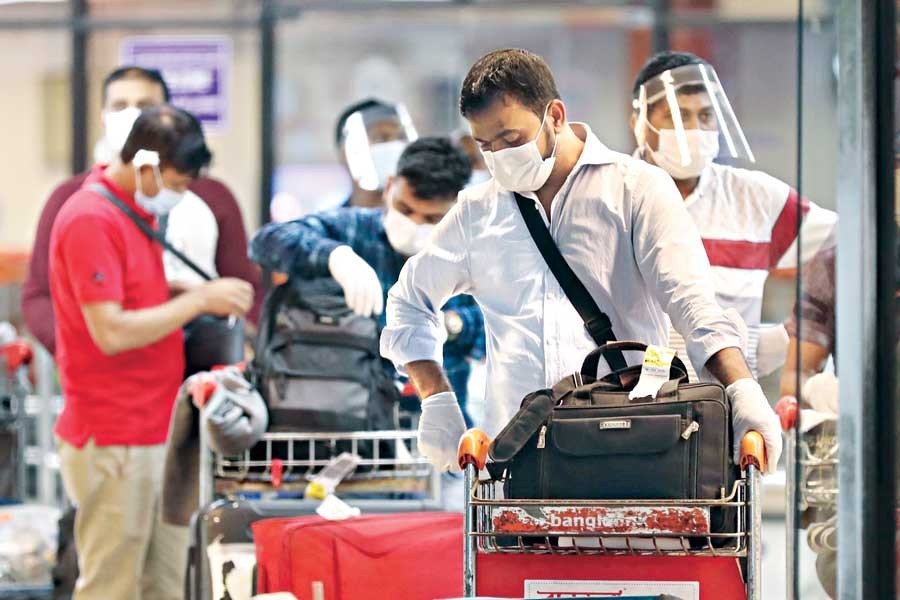 The Bangladeshis who were sent back from Italy arrive at the Hazrat Shahjalal International Airport in the city on Friday — Collected