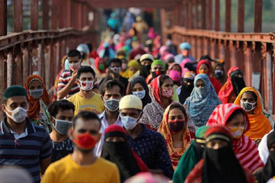 Garment workers return from a workplace as factories reopened after the government has eased the restrictions amid concerns over the coronavirus disease (COVID-19) outbreak in Dhaka, Bangladesh, May 04, 2020 — Reuters/Files