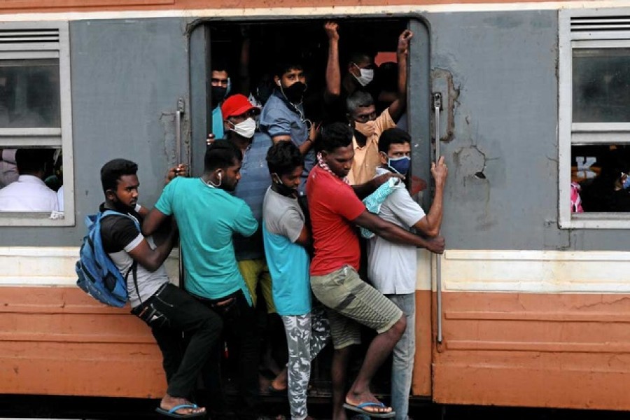 Passengers wearing protective masks travel on an overcrowded train towards the capital city, amid concerns about the spread of the coronavirus disease (Covid-19), in Colombo, Sri Lanka, July 08, 2020 —Reuters/Files