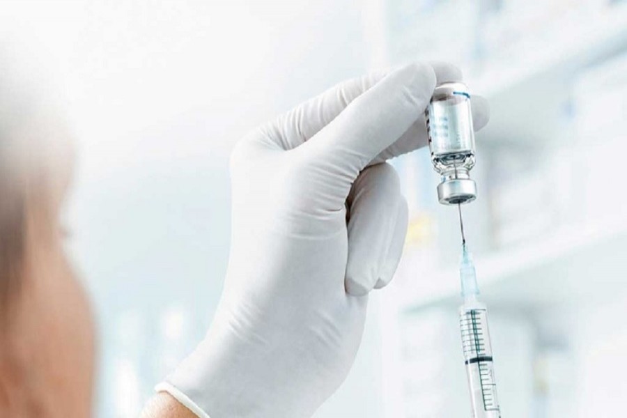 A vial made with borosilicate glass, the material which will be used in vials or syringes to hold the eventual coronavirus disease (COVID-19) vaccine, is pictured with a syringe at an undisclosed location in this undated handout image courtesy of Schott AG — Schott AG/Handout via Reuters