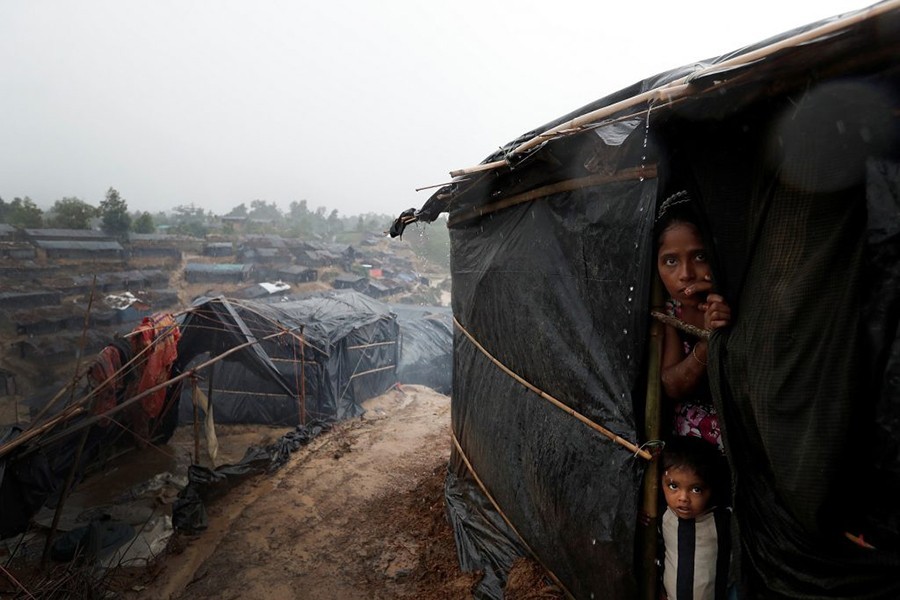 Rohingya refugees look out from a shelter in Cox's Bazar — Reuters/Files