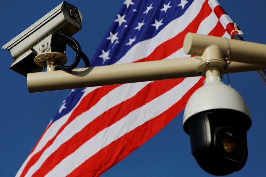 Security cameras are seen in front of a US flag placed near the Forbidden City, ahead of a visit by US President Donald Trump to Beijing, China on November 8, 2017 — Reuters/Files