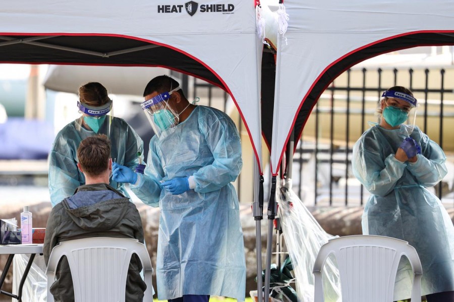 Medical personnel administer tests for the coronavirus disease (Covid-19) at a pop-up testing centre, as the state of New South Wales grapples with an outbreak of new cases, in Sydney, Australia on July 30, 2020 — Reuters photo