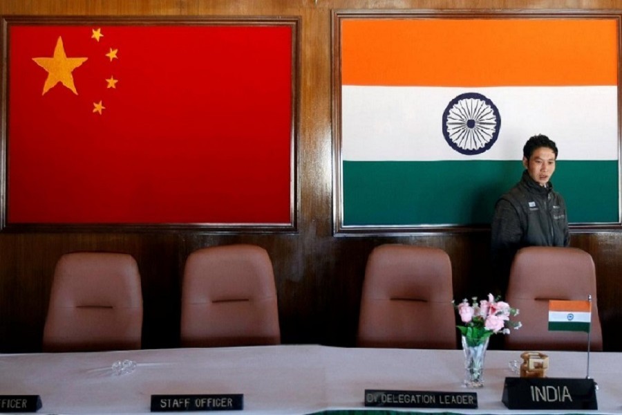 A man walks inside a conference room used for meetings between military commanders of China and India in Arunachal Pradesh, November 11, 2009 — Reuters/Files