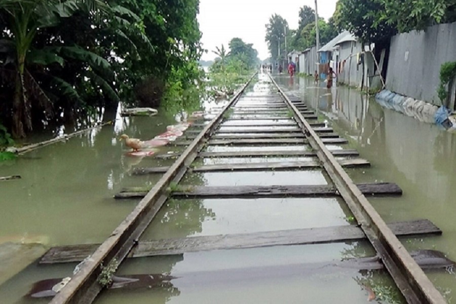 Railway tracks have gone under water due to the flood at Goalanda upazila in Rajbari. The photo is taken on Friday — FE Photo