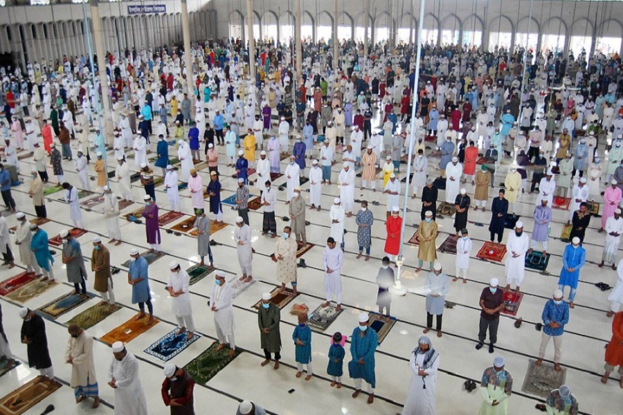 Muslims, wearing masks and maintaining social distance, offer their Eid-ul-Azha prayers at the Baitul Mukarram National Mosque on Saturday morning — Focus Bangla