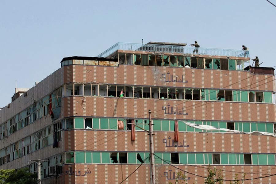 Afghan security forces taking position on a building where the attackers were hiding after an attack on a jail compound in Jalalabad, Afghanistan on Monday –Reuters Photo