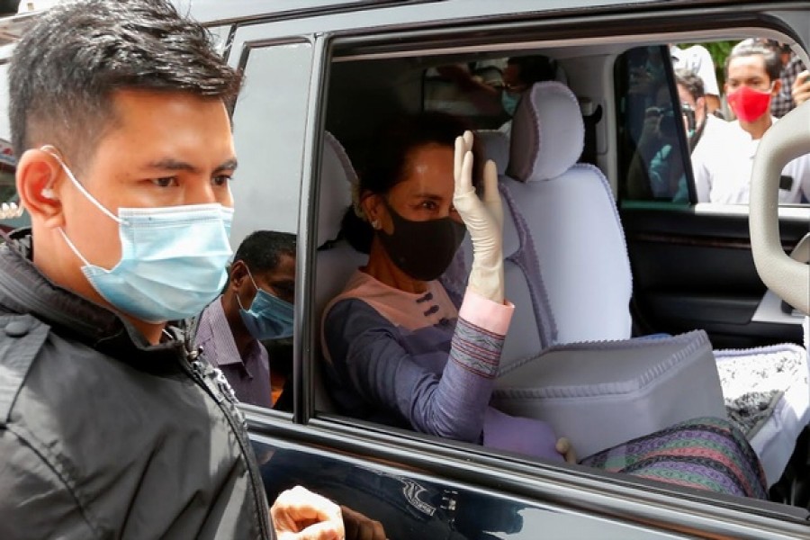 Myanmar leader Aung San Suu Kyi arrives to the electoral commission to formalise her re-election bid as a parliament member in Yangon, Myanmar August 4, 2020. REUTERS