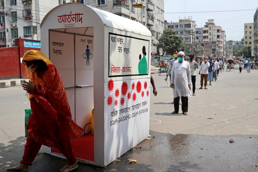 People go through a disinfection tunnel installed by Artoonad, a volunteer organisation, as a preventive measure amid the coronavirus disease (Covid-19) outbreak in Dhaka, Bangladesh, April 16, 2020 — Reuters/Files