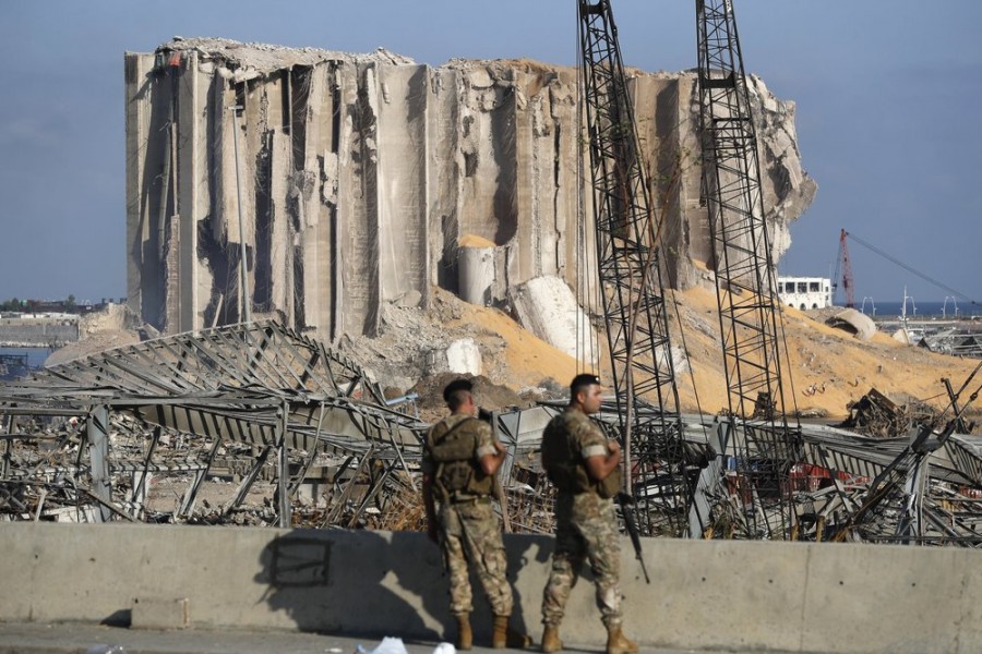 Lebanese army soldiers stand guard at the scene where an explosion hit on Tuesday the seaport of Beirut, Lebanon on Thursday, August 6, 2020 — AP Photo