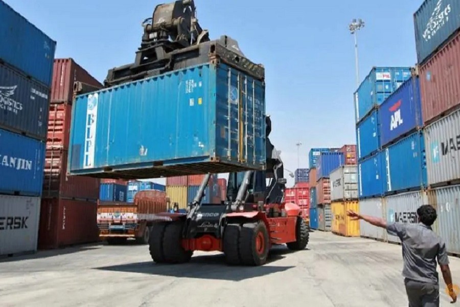 A mobile crane prepares to stack a container at a port in the southern Indian city of Chennai, March 16, 2012 — Reuters/Files