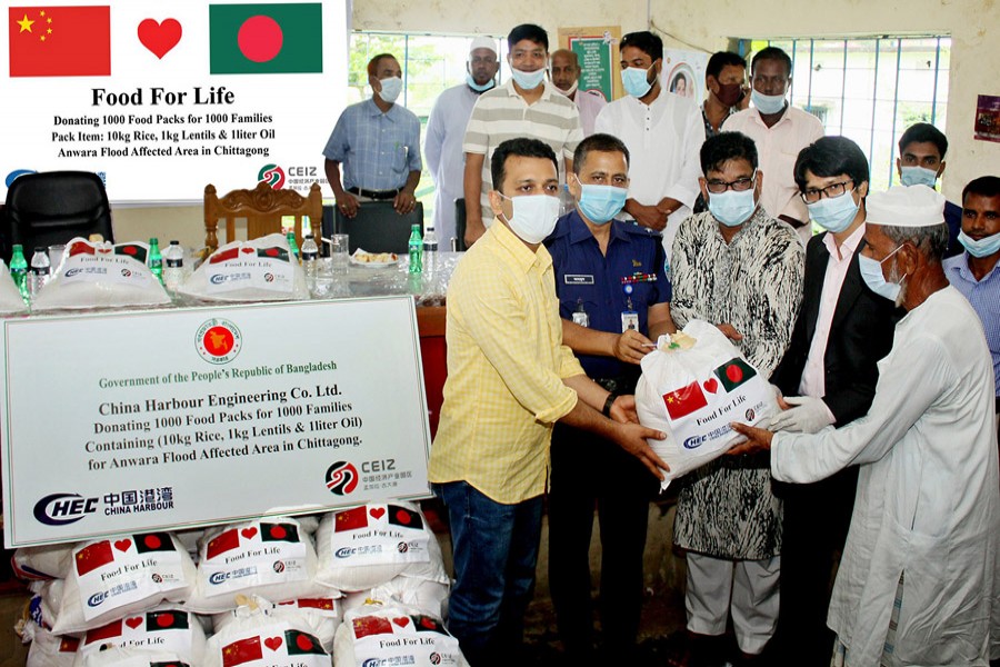 China Harbour distributes foodstuff for the flood victims at Anwara