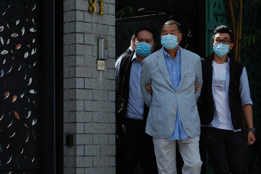 Media mogul Jimmy Lai Chee-ying, founder of Apple Daily (C) is detained by the national security unit in Hong Kong, China August 10, 2020. REUTERS/Tyrone Siu