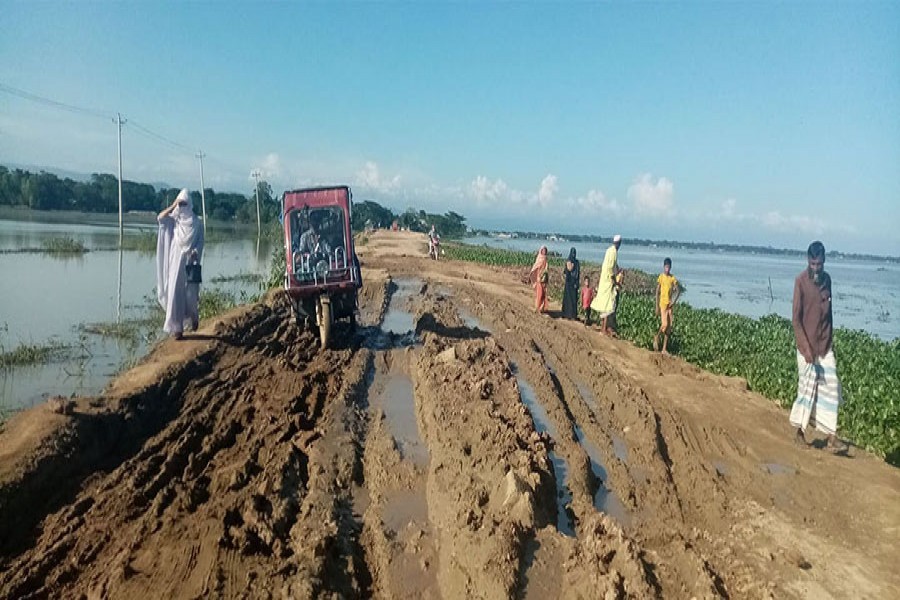 The muddy stretch of the Thakurakona- Kalmakanda road in Netrakona district that is completely unfit for public use — FE photo