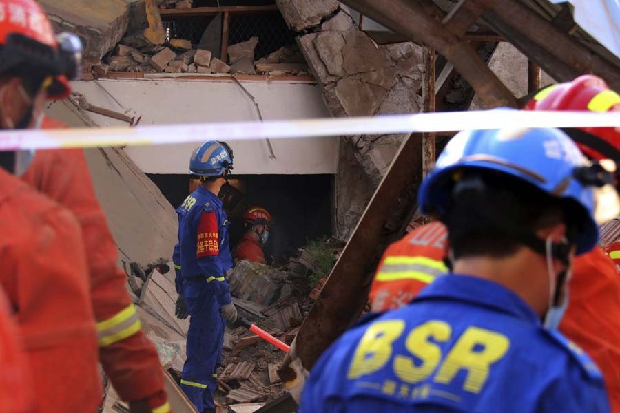 Rescuers searching for victims in the aftermath of the collapse of a two-story restaurant in Xiangfen county in northern China's Shanxi province on Saturday –AP Photo