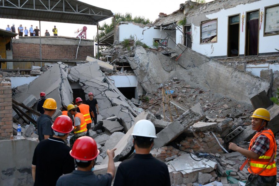 Rescue workers are seen at the site where a restaurant collapsed, in Xiangfen, Shanxi province, China August 29, 2020. Picture taken August 29, 2020. cnsphoto via REUTERS