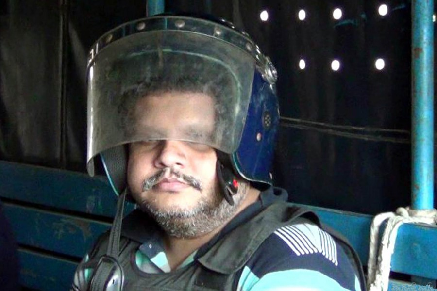 Regent Group chairman Mohammad Shahed looks on as he is escorted to prison from a court in Satkhira — Focus Bangla/Files