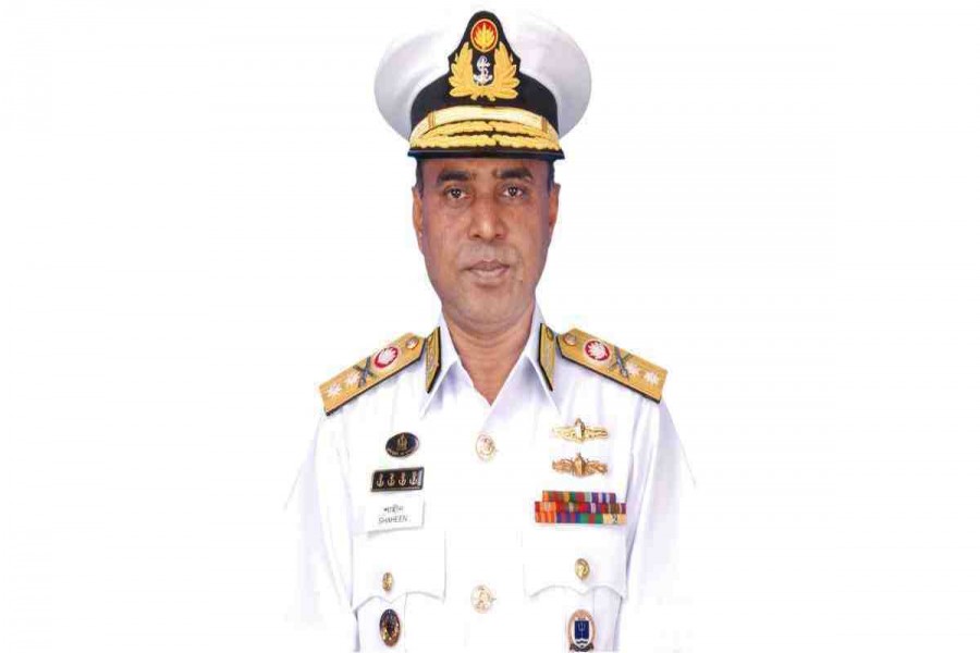 Navy chief adorned with admiral rank badge