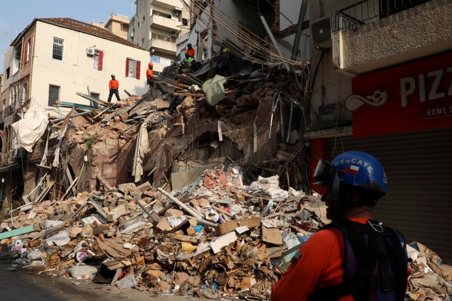 A rescue team searches through rubble of damaged buildings due to the massive explosion at Beirut's port area, in Beirut, Lebanon September 3, 2020. REUTERS/Mohamed Azakir