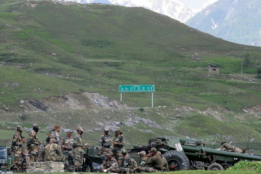 Indian army soldiers rest next to artillery guns at a makeshift transit camp before heading to Ladakh, near Baltal, southeast of Srinagar — Reuters/Files