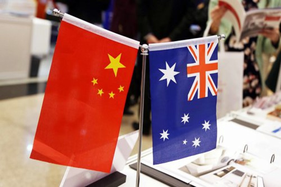 Chinese media accuse Australia of raiding reporters’ homes