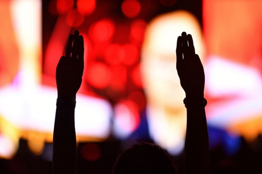 A pro-democracy protester gestures as human rights lawyer Anon Nampa speaks during a mass rally to call for the ouster of prime minister Prayuth Chan-ocha's government and reforms in the monarchy, in Bangkok, Sept 19, 2020. REUTERS