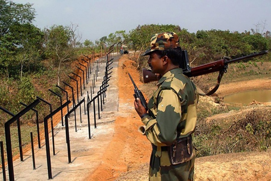 An Indian Border Security Force (BSF) soldier patrols near the border along Bangladesh — Reuters/Files