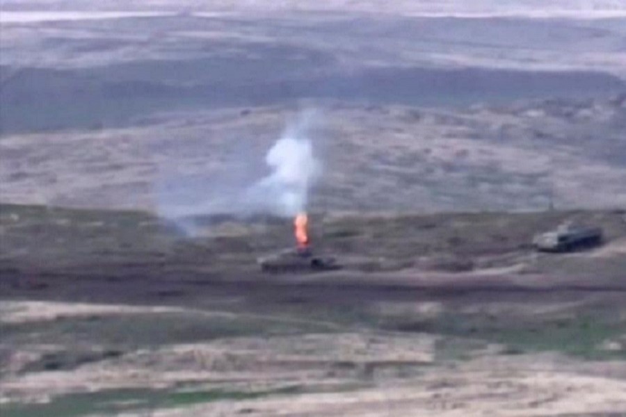 A still image from a video released by the Armenian Defence Ministry shows what is said to be Azerbaijani armoured vehicles, one of which is destroyed by Armenian armed forces in the breakaway region of Nagorno-Karabakh, in this still image from footage released September 27, 2020 — Defence Ministry of Armenia/Handout via Reuters