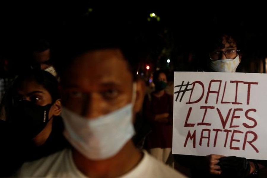 A man holds a placard during a protest after the death of a rape victim, on a street in Mumbai, India on September 30, 2020 — Reuters photo