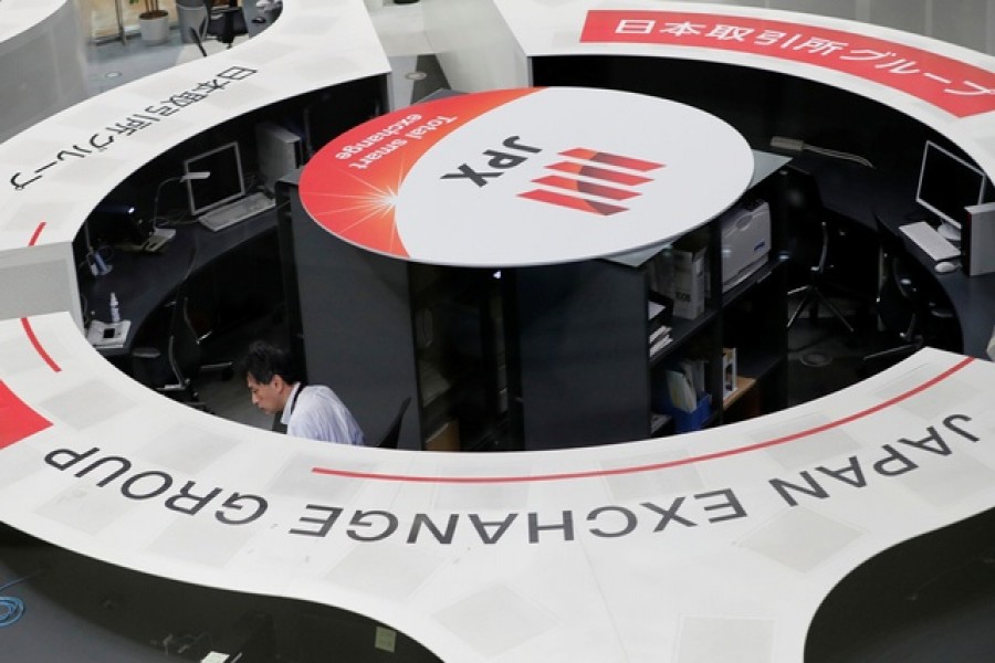 A man works at the Tokyo Stock Exchange after market opens in Tokyo, Japan, October 02, 2020 — Reuters