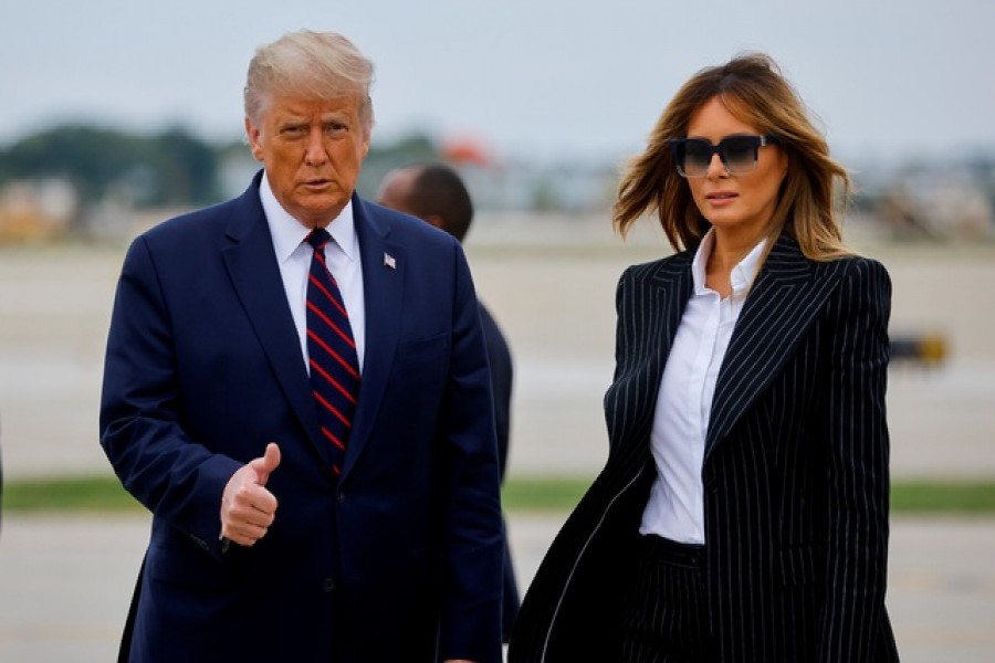 US President Donald Trump walks with first lady Melania Trump at Cleveland Hopkins International Airport in Cleveland, Ohio, US, September 29, 2020 — Reuters