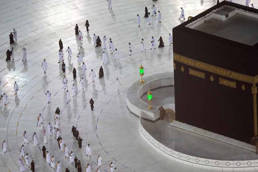 The first group of Muslims, allowed in the mosque compound by appointment, practicing social distancing, as they perform Umrah in the Grand Mosque, after Saudi authorities ease coronavirus disease (COVID-19) restrictions, in the holy city of Mecca, Saudi Arabia, on Saturday –Reuters Photo