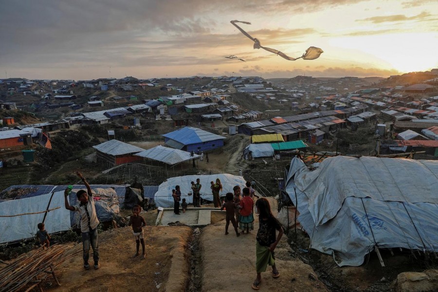 Rohingya refugee children fly improvised kites at the Kutupalong refugee camp near Cox's Bazar, Bangladesh, December 10, 2017 — Reuters/Files