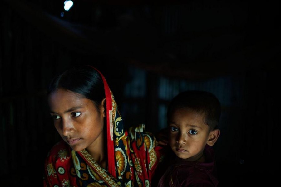 Belkis, 15 years old, holds her one-year-old son in the house where she lives with her mother, two sisters, and one brother. Belkis was married when she was 13 years old to a man who threatened to commit suicide if the family didn’t agree to the marriage. After 14 months, her husband sent her home; he no longer financially supports her or the baby — Human Rights Watch photo