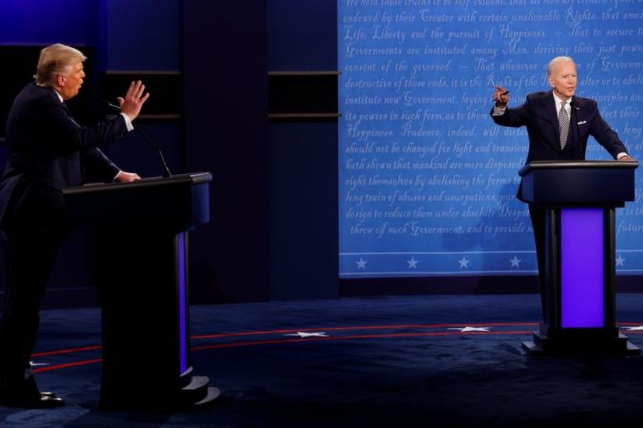 US President Donald Trump and Democratic presidential nominee Joe Biden participate in their first 2020 presidential campaign debate held on the campus of the Cleveland Clinic at Case Western Reserve University in Cleveland, Ohio, US, September 29, 2020. REUTERS/Brian Snyder