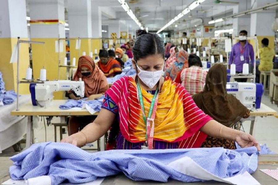 A woman works in a garment factory, as factories reopened after the government has eased the restrictions amid concerns over coronavirus disease (Covid-19) outbreak in Dhaka, Bangladesh, May 3, 2020 — Reuters/Files