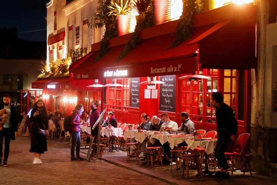 Customers are seen outside a French restaurant in Montmartre few minutes before the nightly curfew due to restrictions against the spread of the coronavirus disease (COVID-19) in Paris on Thursday –Reuters Photo