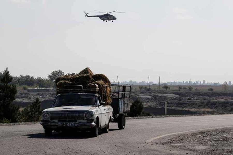 An Azerbaijani military helicopter flying during the fighting over the breakaway region of Nagorno-Karabakh near the city of Terter, Azerbaijan on Friday –Reuters Photo