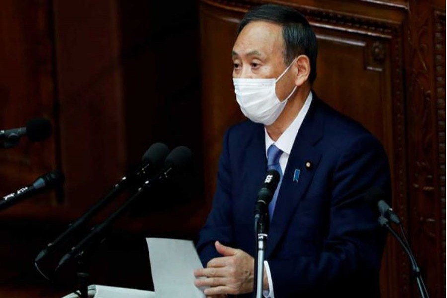 Japanese Prime Minister Yoshihide Suga gives his first policy speech in parliament as an extraordinary session opens in Tokyo, Japan Oct 26, 2020. REUTERS