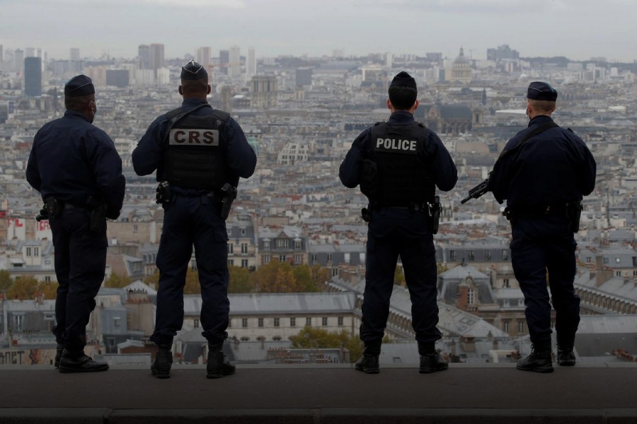 French police and CRS riot policemen patrol in Montmartre in Paris as France has raised the security alert for French territory to the highest level after the knife attack in the city of Nice, France, October 30, 2020. REUTERS/Charles Platiau