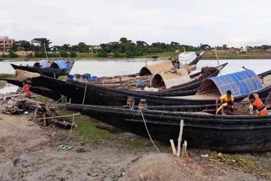 Fishermen have kept ready boats along with fishing equipment at Dublar Char in the Sundarbans to embark on their journey towards the deep sea for fishing. The picture was snapped on Sunday — FE Photo