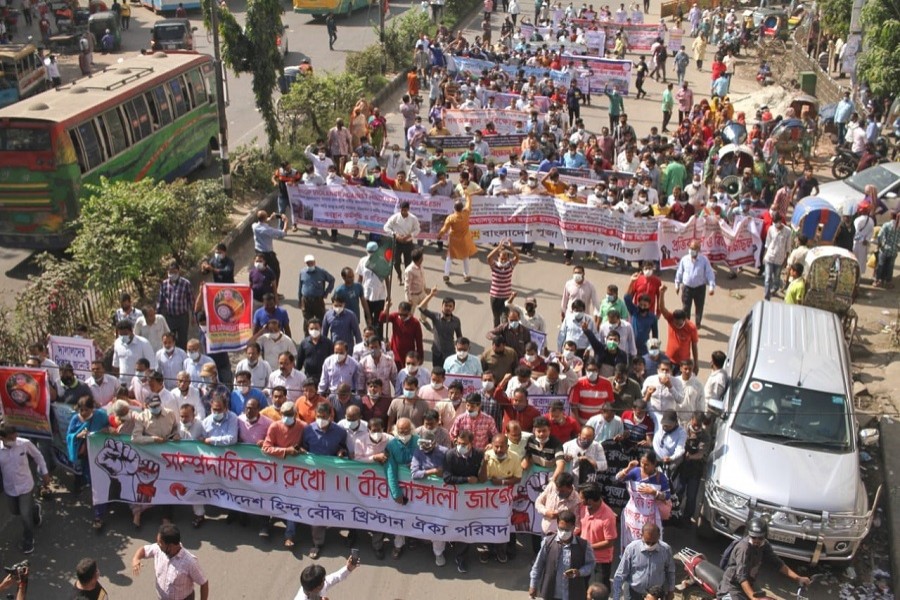 Hindus, Buddhists and Christians hold a rally in Dhaka’s Shahbagh on Saturday protesting attacks on them in the country — UNB