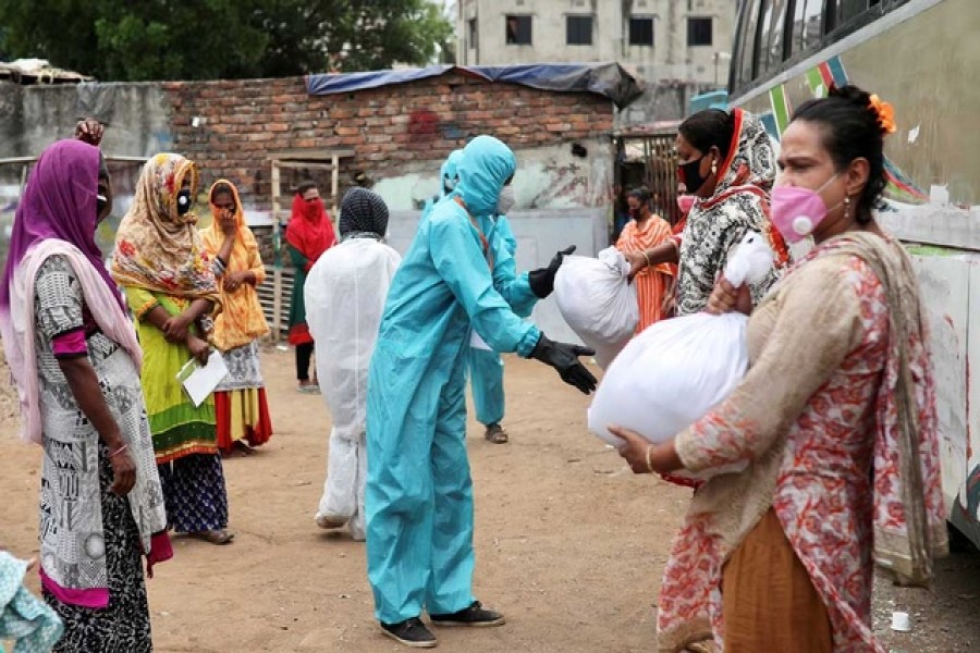 Volunteers from an organisation distribute relief supplies among transgenders, amid the coronavirus disease (Covid-19), in Dhaka, April 23, 2020 — Reuters/Files