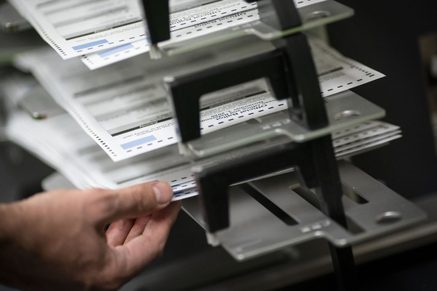 In this November 3, 2020, file photo, poll workers sort out early and absentee ballots at the Kenosha Municipal building on Election Day, in Kenosha, Wisconsin, US — AP photo