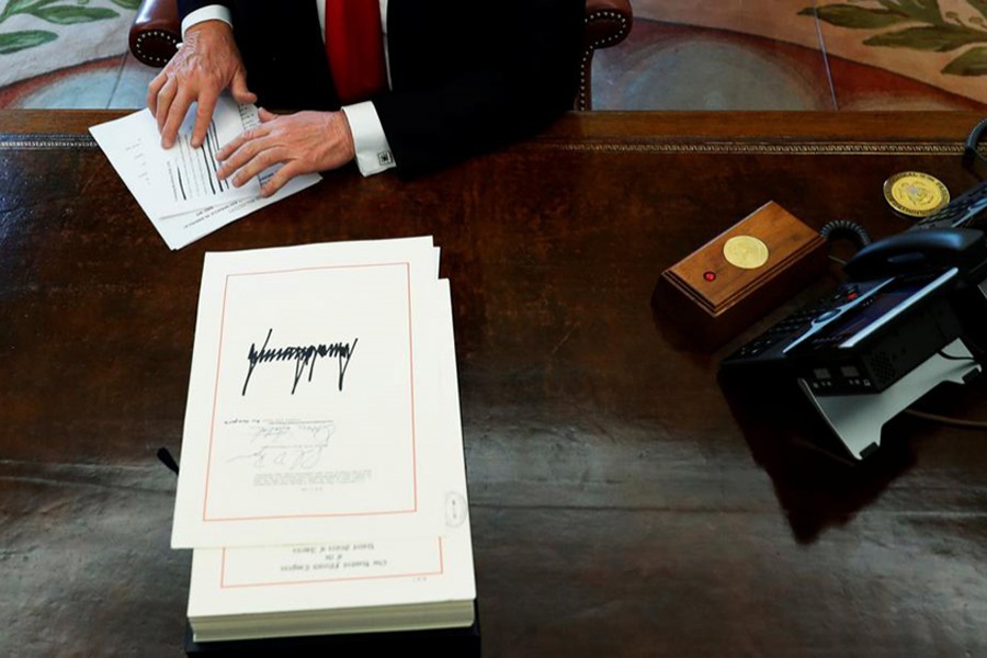 US President Donald Trump at his desk in the Oval Office at the White House in Washington — Reuters/Files